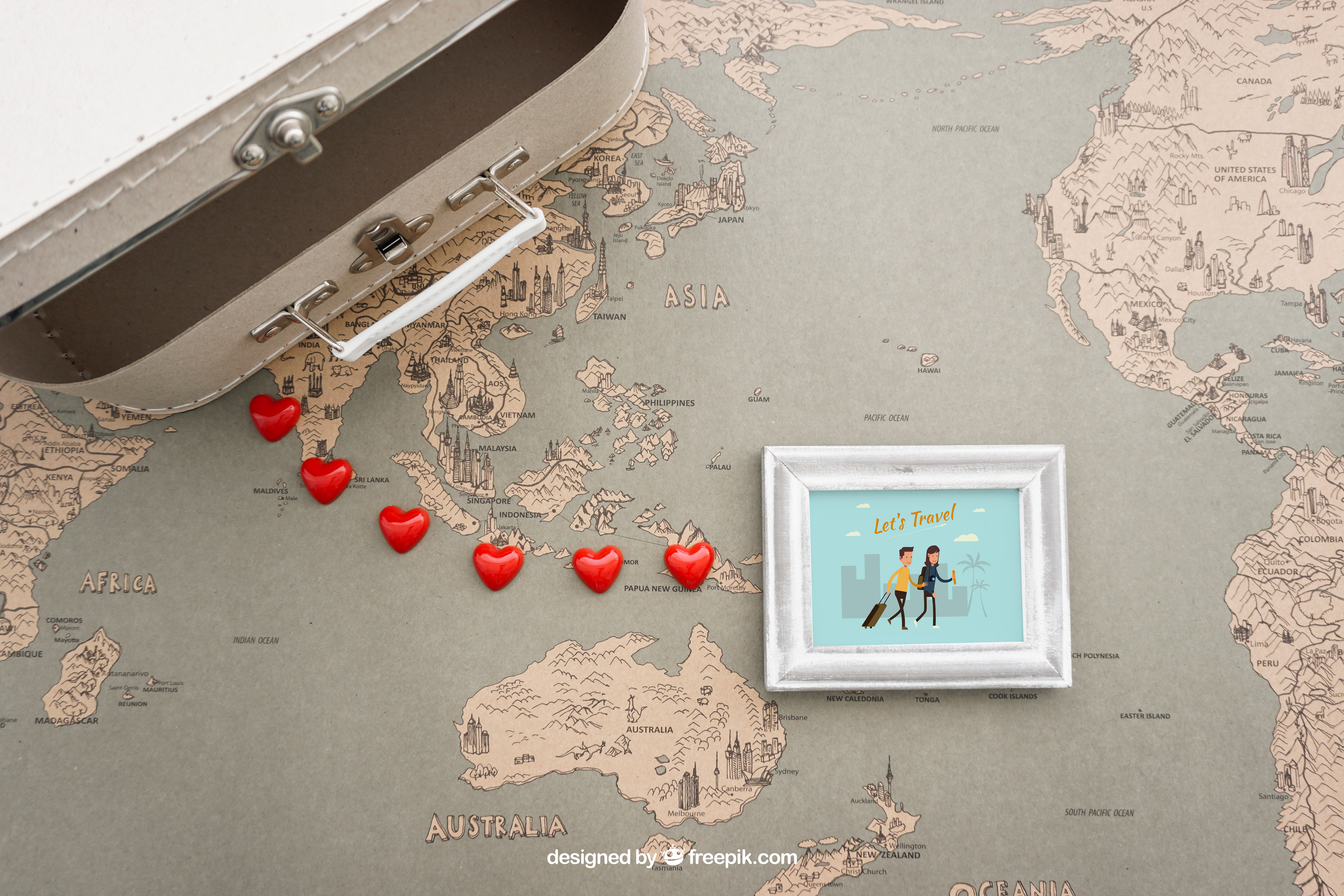 A szerelmes szokások - valentin-nap ünneplése más országokban blog bejegyzés illusztrációja. Egy bőröndöt láthatunk egy világtérképen és sz0vek visynek egy képkerethez, amiben egy rajzolt pár látható.